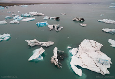 Floating icebergs in Jökulsárlón glacier lagoon in Iceland. Aerial photo captured with a camera drone (Phantom) by Paul Oostveen.