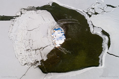 Frozen lake in Iceland, with snow pushed together like a harmonica. Aerial photo captured with a camera drone (Phantom) by Paul Oostveen.