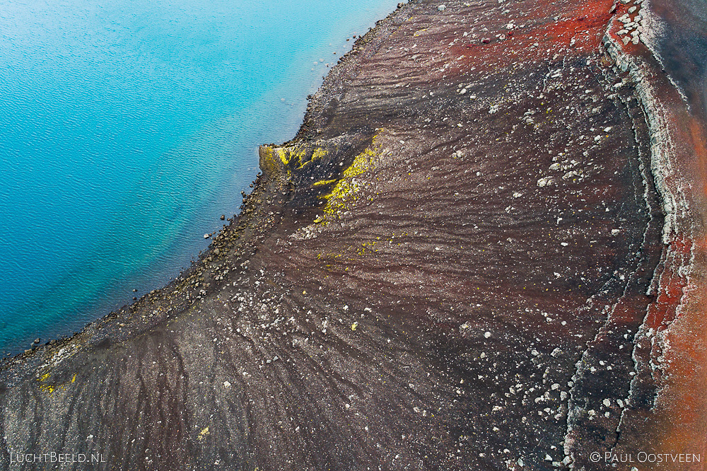 Edge of the Bláhylur crater lake in Fjallabak in Iceland. Aerial photo captured by drone.