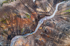 Mountain stream in Kerlingarfjöll mountains in the highlands of Iceland. Aerial photo captured by drone.